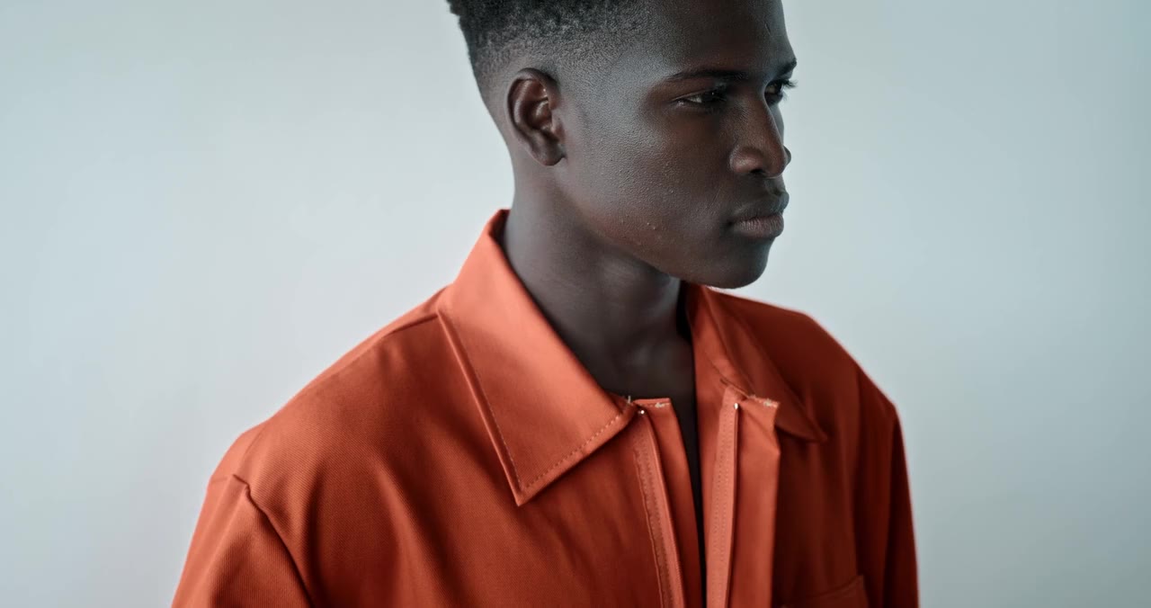 Man zipping up his shirt, by cottonbro studio, on Pexels