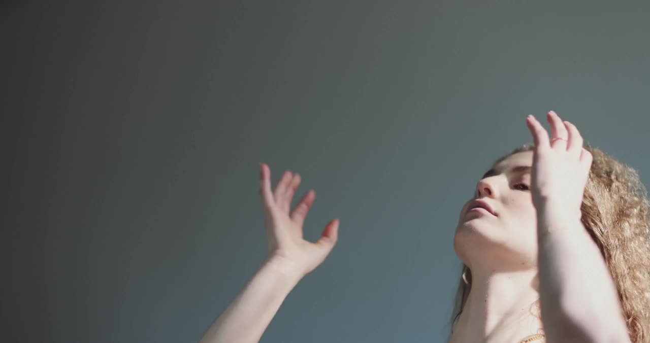 Woman fixing her hair, by Jill Burrow, on Pexels